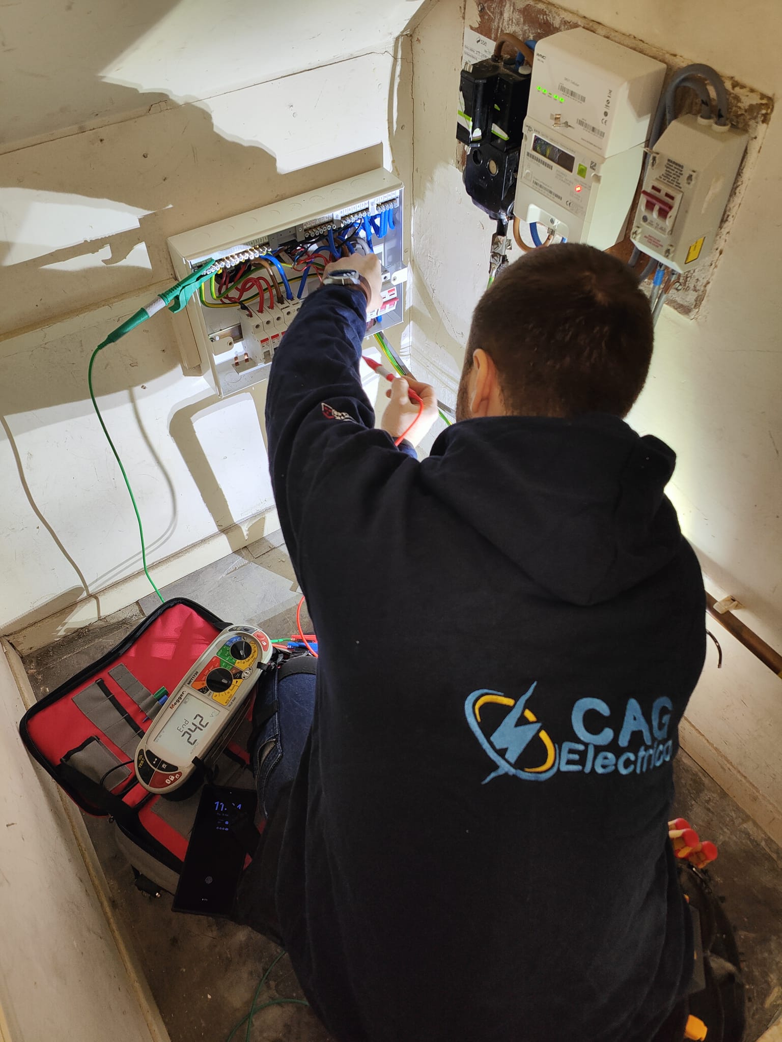 CAG Electrical Ltd electrician carrying out inspection and testing at a consumer unit